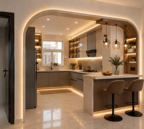 Modern kitchen with warm lighting and a breakfast counter