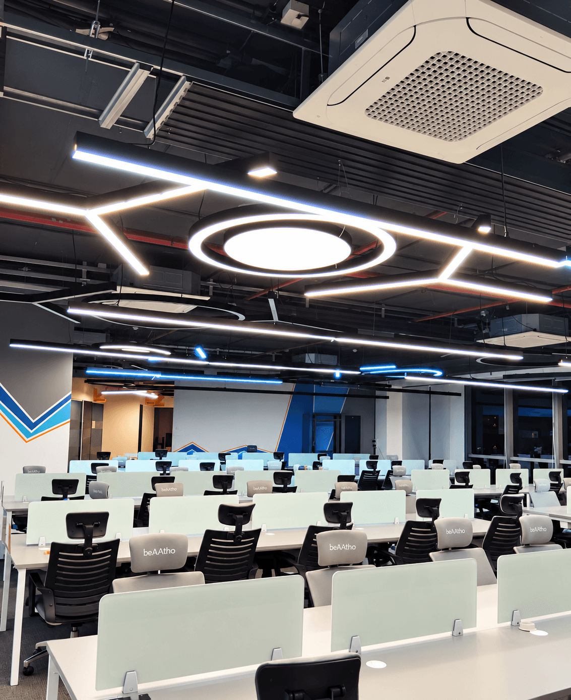 World Development Corporation office: Open-plan office with geometric lighting
