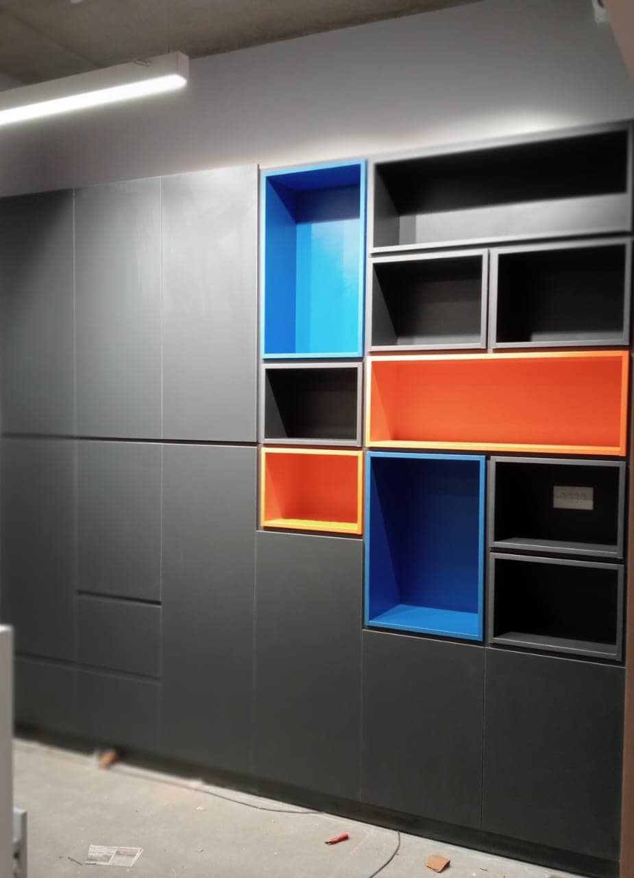 World Development Corporation office: Custom storage with colour accents