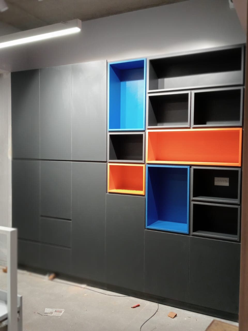 World Development Corporation office: Integrated storage wall