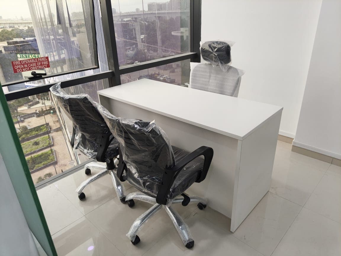 World Development Corporation office: Daylit desk and seating